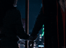 a picture of a man and woman looking out a window with the word kepler on the bottom