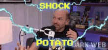 a man talking into a microphone with the words shock potato dark web written above him