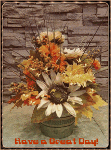a bouquet of flowers with the words have a great day on the bottom