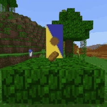 a blue and yellow banner is on a green block in a minecraft world