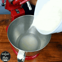 flour mixture a knead to bake putting flour into the machine pouring the flour