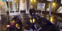 a group of people laying on the floor with a sign that says mc on it
