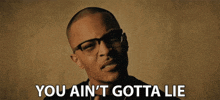 a man wearing glasses says you ain t gotta lie