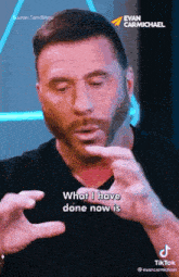 a man with a beard is talking about what he has done