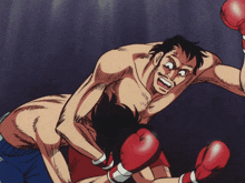 a man in red boxing gloves is being punched