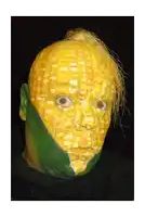 a person with their face painted like corn