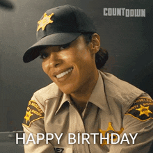 a woman in a sheriff 's uniform is smiling with the words happy birthday below her