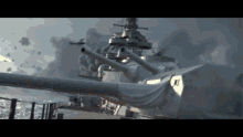 a large white ship with a lot of guns on it