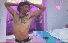 a man without a shirt has a tattoo on his chest that says " not skill jade "