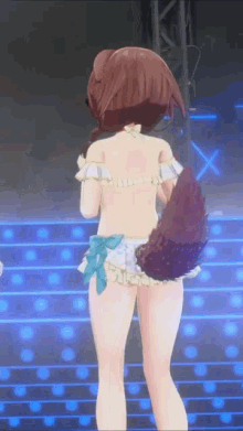 a girl in a bikini is standing on a stage with a dog tail .