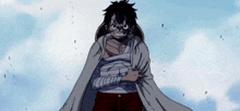 a person with a bandage on their chest is standing in front of a cloudy sky