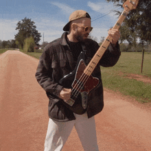 Playing The Bass Guitar Can'T Swim GIF - Playing The Bass Guitar Can'T Swim No Backbone Song GIFs