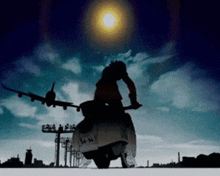 a silhouette of a person riding a scooter in front of a plane