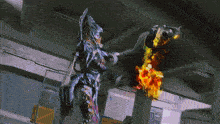a cartoon character is holding a torch with flames coming out of it 's mouth