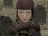 a woman with her eyes closed in a cemetery with graves