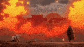 a man is kneeling in front of a large explosion