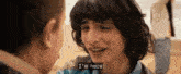 a close up of a person 's face with a caption that says `` i 'm here ''