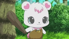 a white teddy bear is holding a wooden bat in its paws .