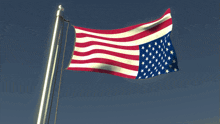 an american flag is flying in the wind