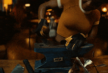 a close up of a person grinding a piece of metal with the word kepler visible in the corner