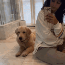 a woman taking a picture of herself and a dog with gifcamilas written on the bottom