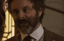 a close up of a man with a beard and a caption that says itsscottiesstark