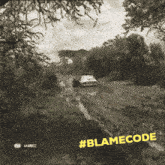 a black and white photo of a car on a muddy road with #blamecode on the bottom