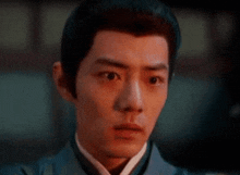 a close up of a man 's face with a very serious expression .