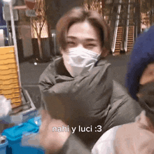 a man wearing a face mask with the words nahi y luci : 3 written on the bottom