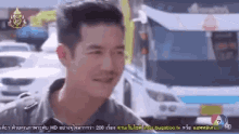 a man is smiling in front of a bus on a screen that says 7 hd