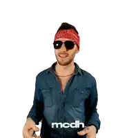 a man wearing a bandana and sunglasses is standing in front of a white background that says mcdh