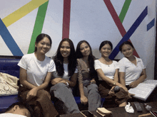 a group of young women are posing for a photo