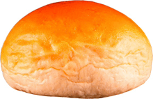 a close up of a hamburger bun with a white crust
