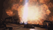a large explosion with a lot of fire coming out of it