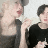 a man and a woman are standing next to each other with tiktok written on the bottom right