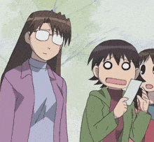 a woman with glasses stands next to two other girls
