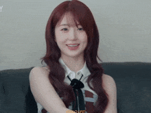 a girl with red hair is smiling with the word life visible in the corner