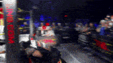a blurred image of a wrestling ring with king.com written on the side