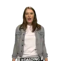 a woman wearing a denim jacket and a white shirt with the word dasding on her belt
