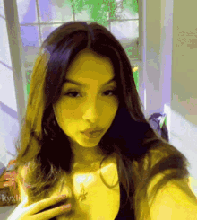 a girl is taking a selfie with the name kylie on the bottom