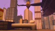 a helicopter is flying over a city with a yellow container on top that says ' a ' on it
