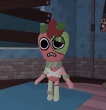 a cartoon character that looks like an apple with a scar on its face