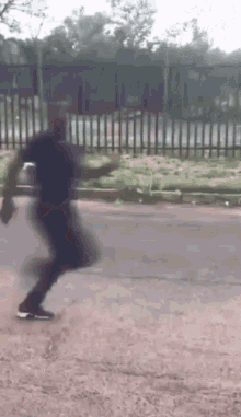 a blurry picture of a person walking down a road .