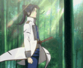 a man in a white coat is holding a sword in a forest .