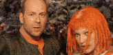 a man and a woman are standing next to each other