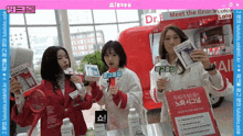 a group of women standing in front of a sign that says meet the real heritage