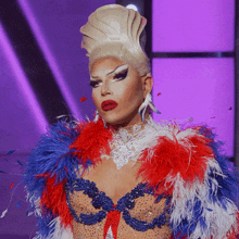 a drag queen wearing a red white and blue outfit
