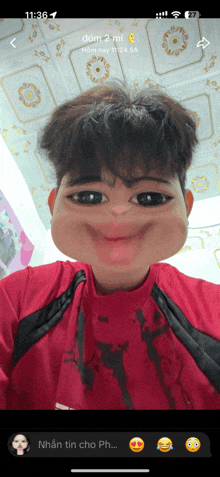 a phone screen shows a picture of a man with a funny face