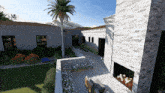 an aerial view of a house with a fireplace and a palm tree