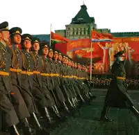 a group of soldiers marching in front of a banner that says ' a ' on it